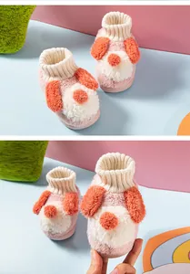 Close-up of adorable plush dog slippers for toddlers with soft cartoon puppy design
