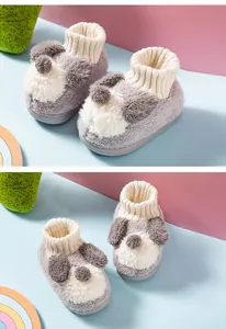 Close-up of adorable puppy plush children's slippers with soft ribbed ankle cuffs
