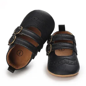 Classic black faux leather baby princess shoes with soft soles and brogue details