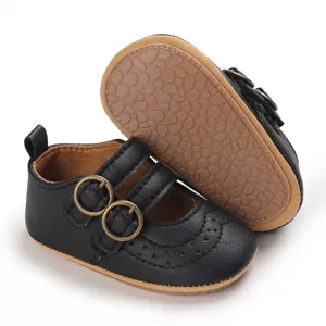 Detailed view of black baby princess shoes featuring double straps and a soft textured sole