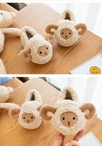Detailed close-up of soft plush sheep cartoon baby slippers for indoor warmth