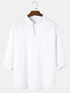 Close-up detail of men's white casual V-neck long sleeve shirt with chest pocket