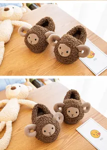 Detailed close-up of cute brown cartoon sheep plush baby slippers for indoor winter warmth