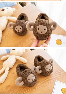 Detailed close-up showing the soft texture of adorable brown sheep-themed plush slippers for toddlers