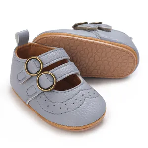 Close-up of soft-sole baby walking shoes in light blue with decorative buckles