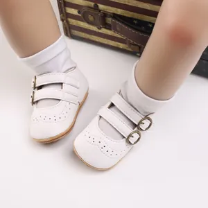 White soft-sole infant princess shoes featuring double buckles and wingtip detailing style