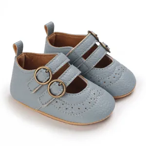 Close-up of light blue baby Mary Jane shoes with soft soles and buckle straps