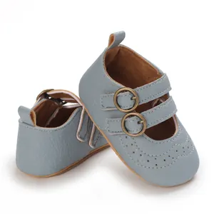 Detail view of blue soft-sole baby Mary Jane shoes with metal buckle straps