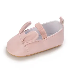 Detailed close-up of pink baby walker shoes featuring adorable cartoon rabbit ear design