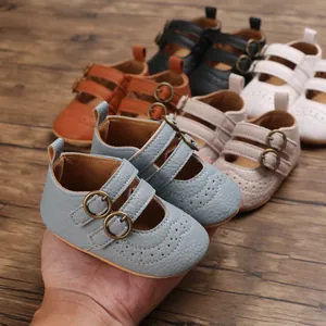 Macro view of soft-sole baby princess shoes with double buckle straps and embroidery