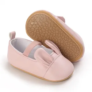 Pink soft sole baby girl walking shoes featuring adorable cartoon rabbit ear design