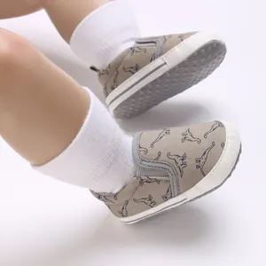 Soft sole baby walking shoes with dinosaur pattern for infants aged 0-1 years old.