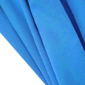 Macro view of bright blue fabric texture for men's solid color jogger pants
