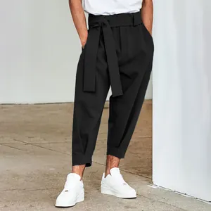 Stylish men's black cropped trousers featuring a high-waisted self-tie belt design.