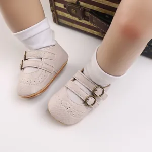 Close-up detail of beige baby princess shoes featuring soft soles and adjustable buckle straps.