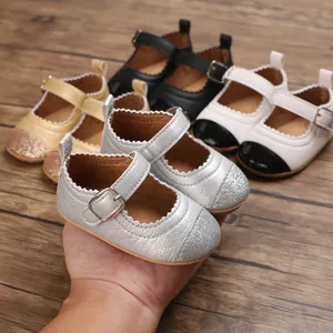 Detailed view of baby girl walking shoes featuring glitter toes and soft soles in multiple colors