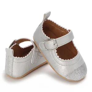 Detail shot of silver baby Mary Jane shoes with glitter toe and soft non-slip sole.