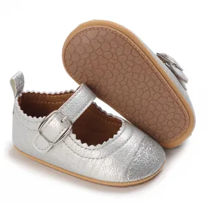 Detail of silver baby walking shoes with glitter toe and soft non-slip sole.