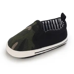 Side view of a soft sole baby walker shoe with camouflage and black canvas