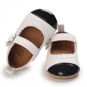 Close-up of baby girl Mary Jane walking shoes with black patent leather toe cap