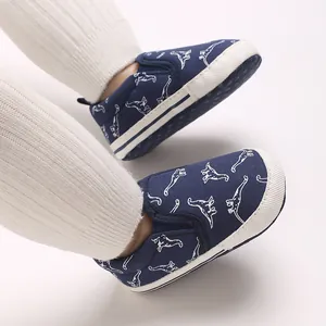 Navy blue canvas baby walking shoes with white dinosaur pattern and soft anti-slip sole