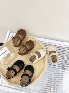 Classic toddler Mary Jane leather shoes displayed in brown, cream, and black colors