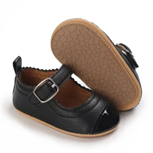 Detail of black baby Mary Jane shoes with non-slip rubber sole and patent leather toe
