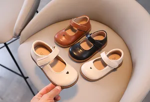 Elegant Korean style children's Mary Jane shoes with heart cutout and velcro strap closure