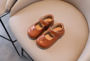 Classic brown girls Mary Jane leather shoes with cute heart cutout and soft sole for kids