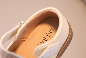 Close-up of soft leather insole and heel lining of beige toddler Mary Jane shoes