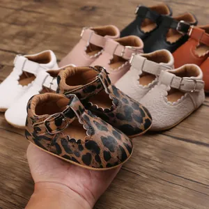 Close-up of leopard print baby Mary Jane walking shoes with soft soles and T-straps.