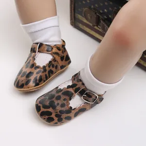 Detailed view of leopard print baby walking shoes with soft soles and buckle strap