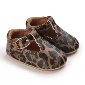 Detailed macro view of leopard print baby walking shoes with T-strap and silver buckle