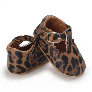 Close-up detail of leopard print baby Mary Jane soft sole walking shoes with metal buckle strap