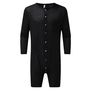 Men's solid black long-sleeve bodysuit with button front and chest pocket design