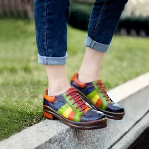 Vibrant handmade colorful patchwork leather lace-up shoes for women in outdoor park