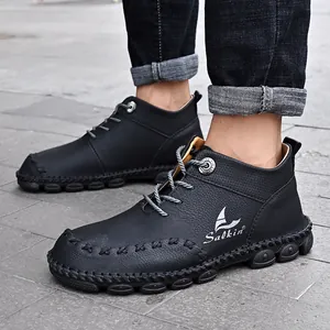 Close-up of black hand-stitched leather work boots with Salkin logo details