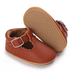 Close-up of brown baby Mary Jane shoes showing soft non-slip pebble-textured sole