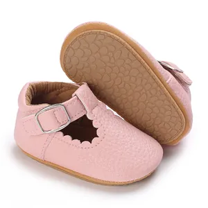 Detail view of pink baby princess shoes with soft anti-slip sole and scallop edges.