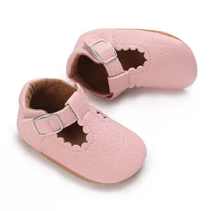 Pink soft-sole baby girl princess shoes with scalloped edges and metal buckle strap.