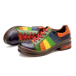 Detailed view of colorful patchwork genuine leather shoes with handmade color rubbing.