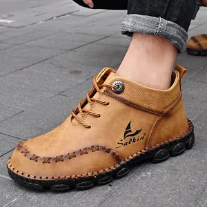 Hand-stitched tan leather Martin boots for men with durable rubber sole detail