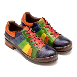 Detailed view of hand-painted colorful patchwork genuine leather women's sneakers
