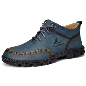 Detailed view of handmade blue mid-top Martin boots for men with leather texture