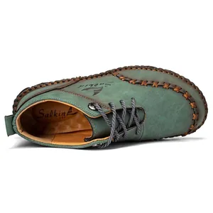 Close-up detail of teal hand-stitched mid-cut Martin boots for men with Salkin USA branding