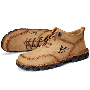 Side view detail of brown handmade stitched mid-top men's casual outdoor work boots