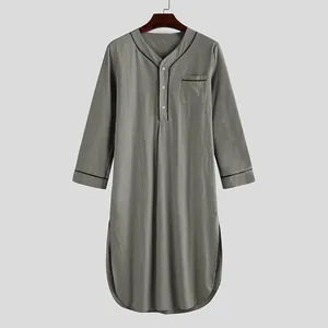 Detailed front view of men's gray long-sleeve nightgown with contrast piping detail.