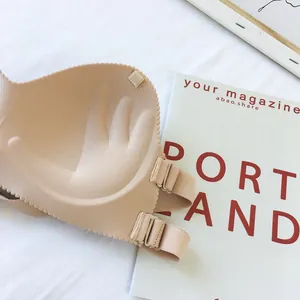 Close-up of beige strapless push-up bra with unique palm-shaped inner padding