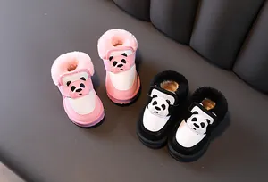 Detailed view of warm panda-themed toddler snow boots with plush faux fur lining.