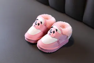 Detail of pink baby winter snow boots with cute panda pattern and faux fur lining